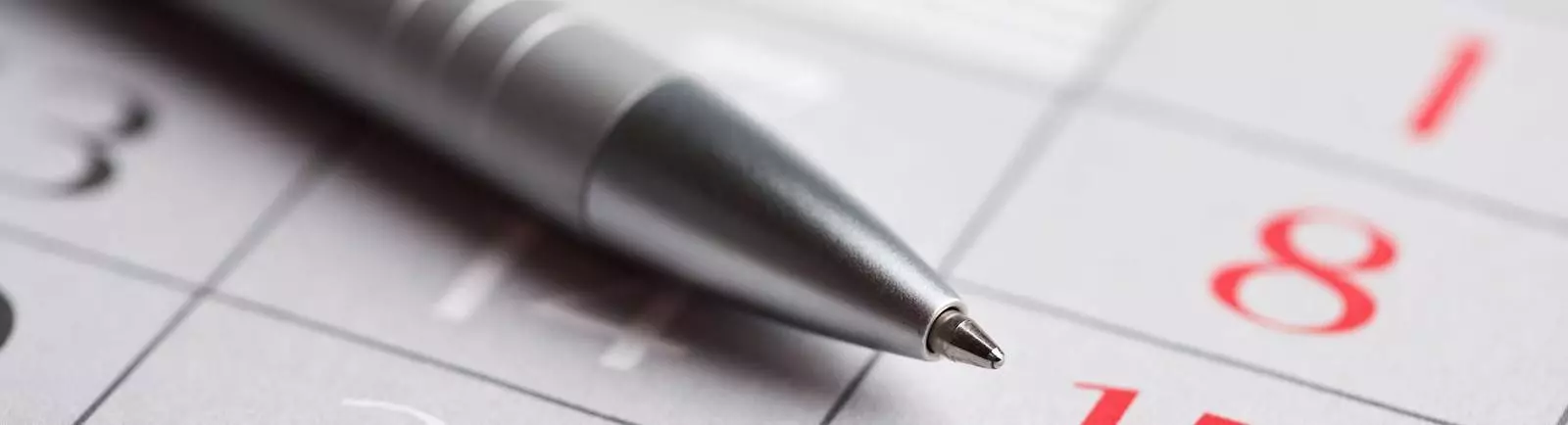 close up of a pen on a calendar