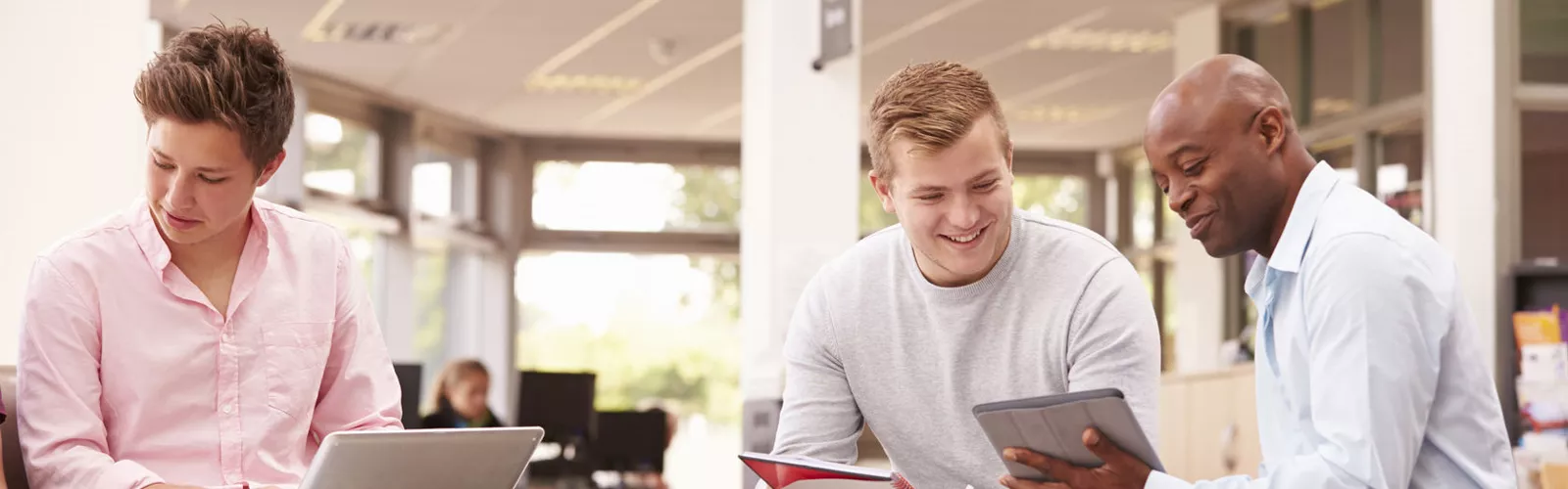 student being tutored in the library