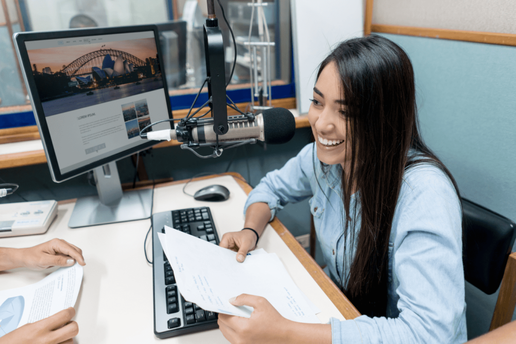 Student interviewing someone across a desk from her