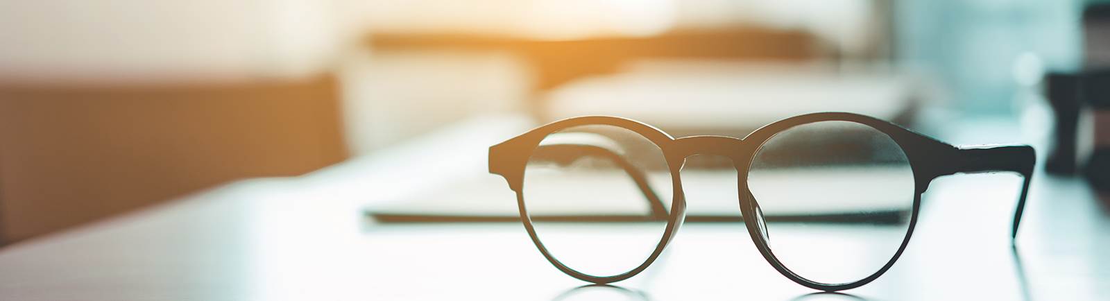 glasses sitting on a desk