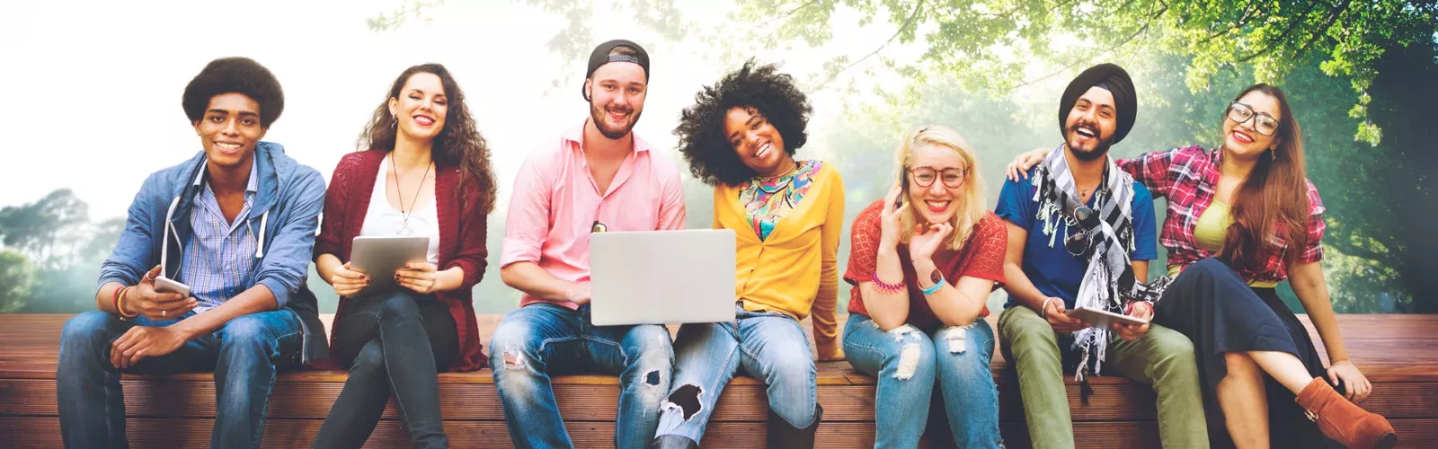 students on computers outside