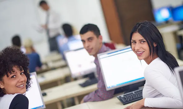 students in a classroom with computers