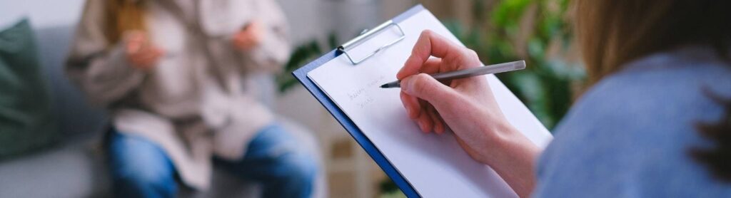 woman holding clipboard to arrange next meeting