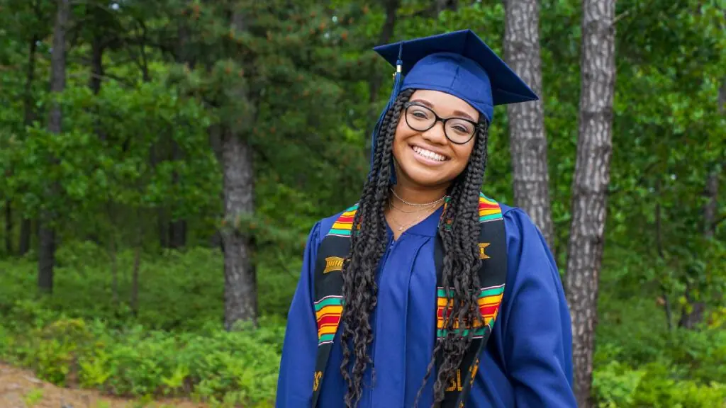 woman in graduation cap and gown.