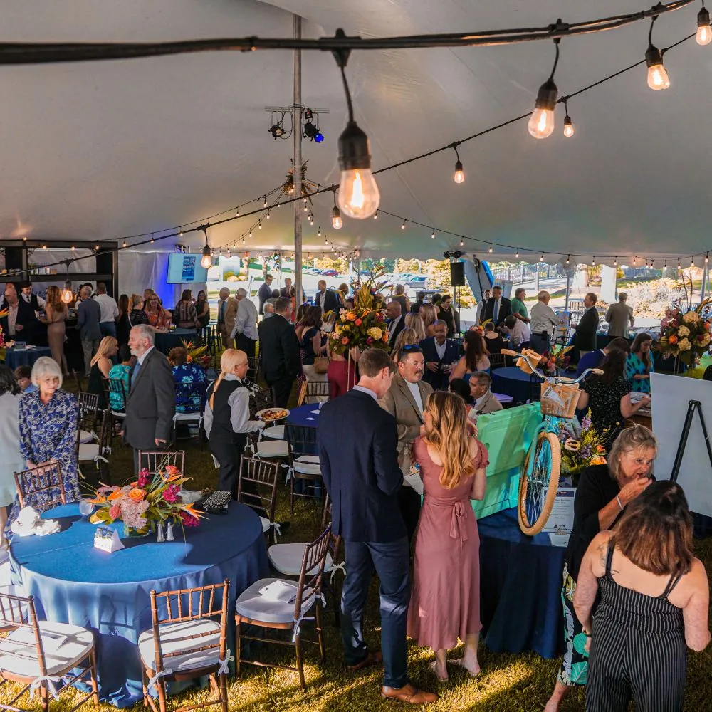 Wide shot of people mingling at a special event