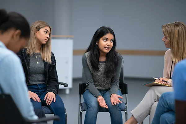 Students talking during a group therapy session