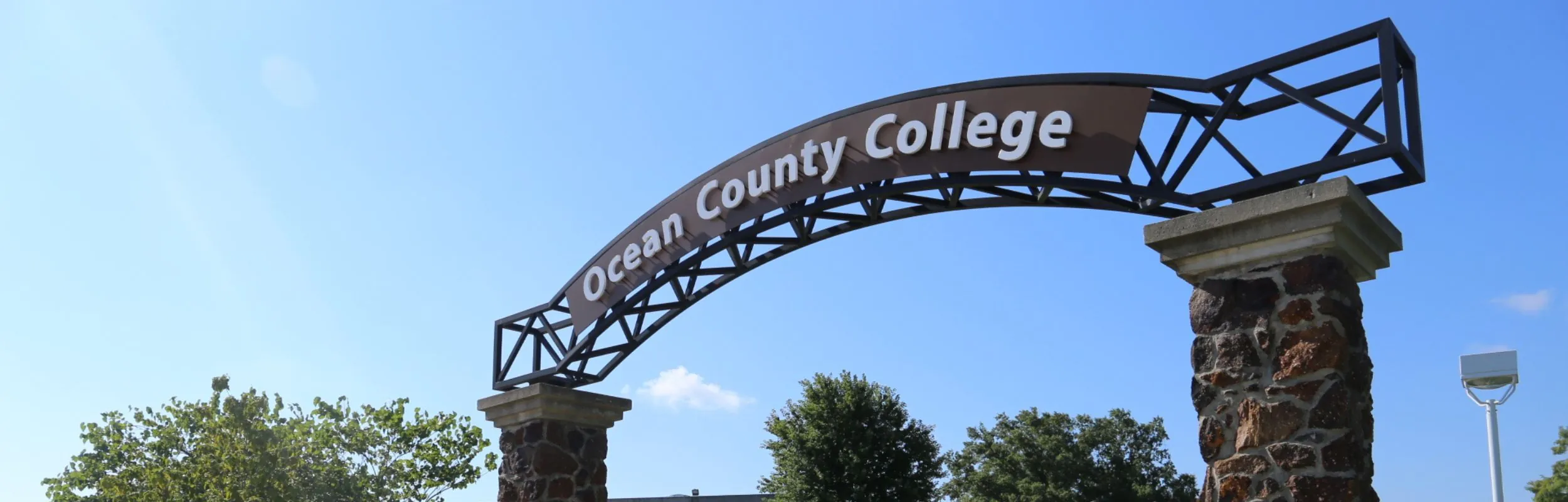 OCC arched sign