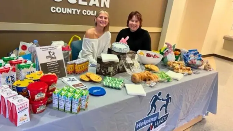 Two women at Helping Hands table