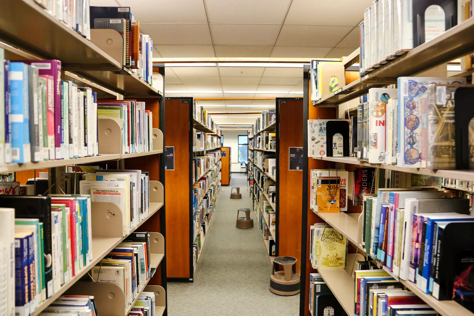 rows of bookshelves in library