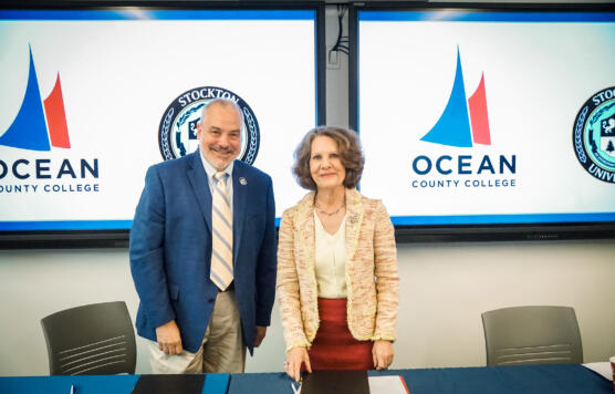 President Monaco and President Bertolino in classroom with Ocean and Stockton Logos