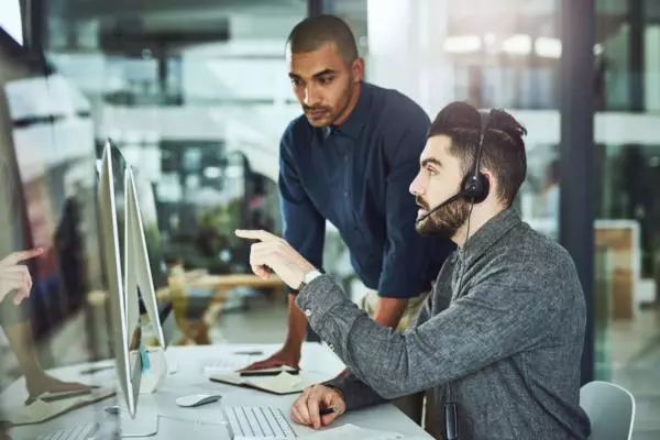 Two men working on a computer