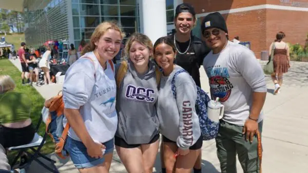 students posing together outside