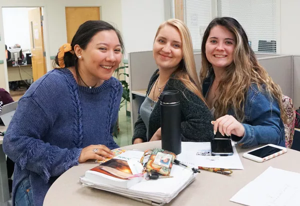 three female students in the student lounge