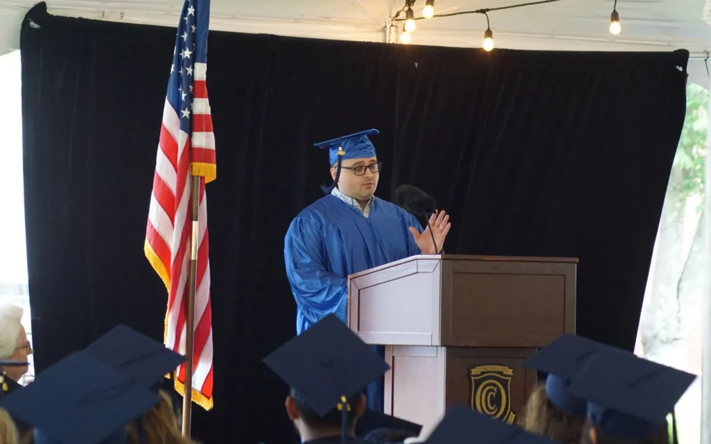 Graduate Nicolas Pinero Mortarboards speaking at graduation