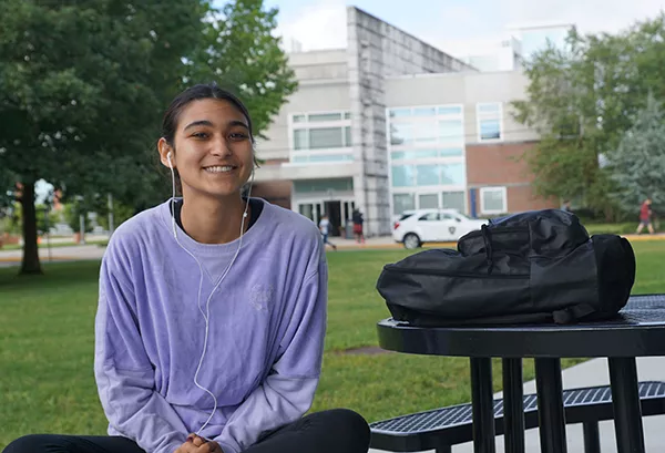 female college student sitting on OCC campus