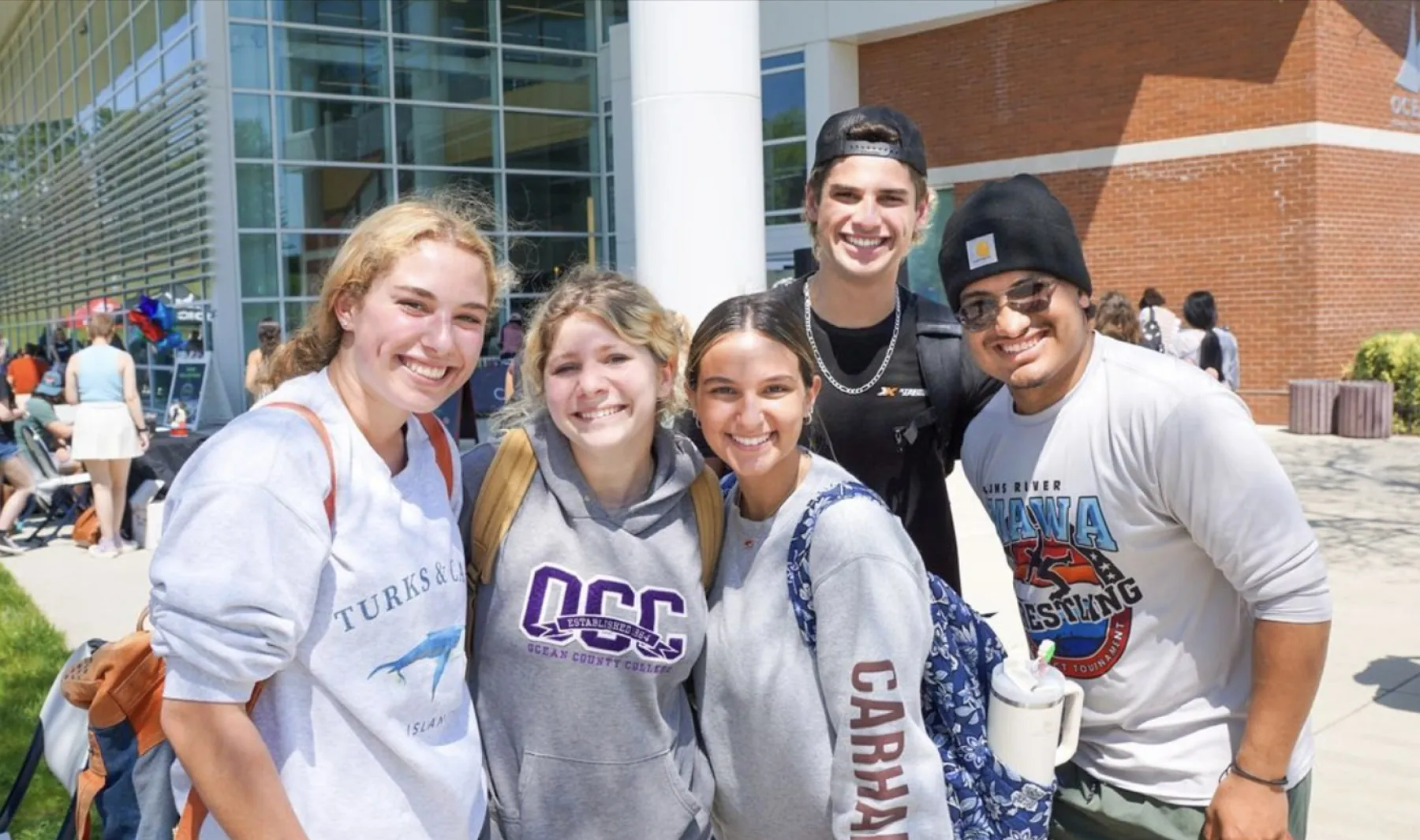 A group of smiling students on campus